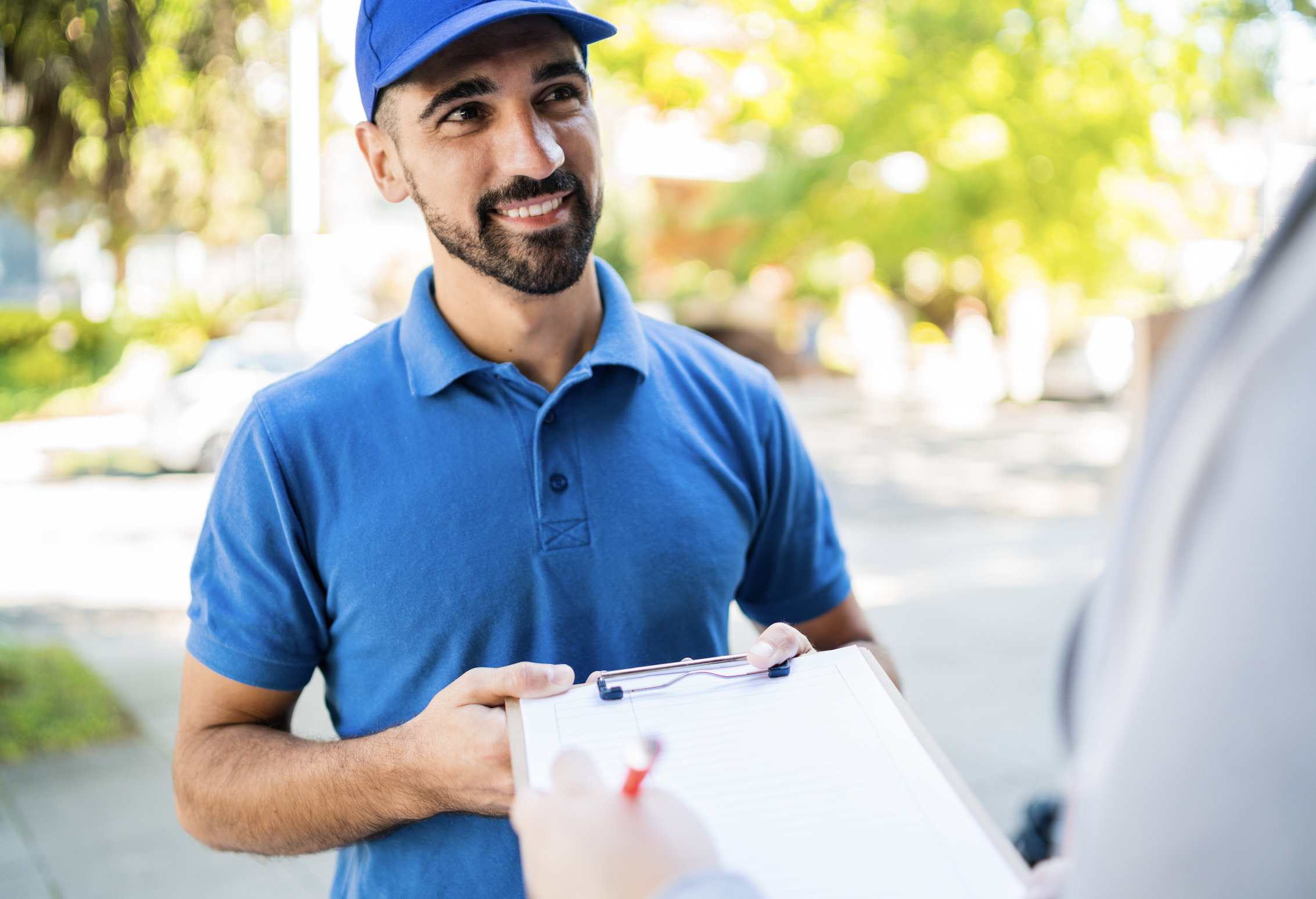 delivery driver getting a document signed